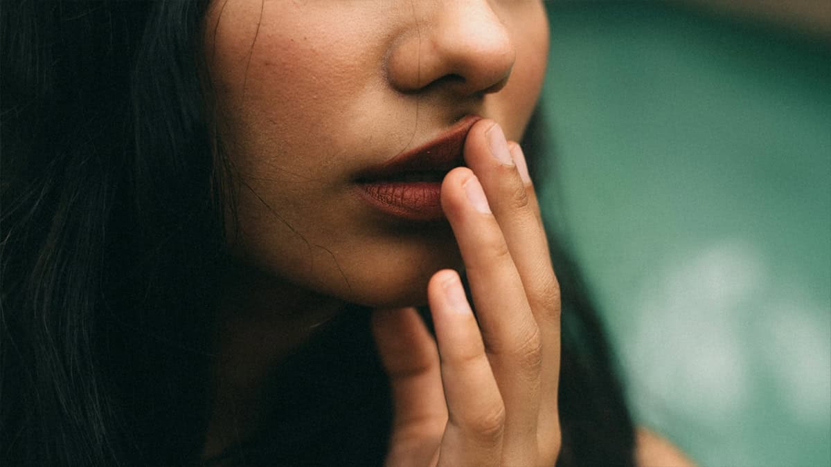 A women covering her mouth