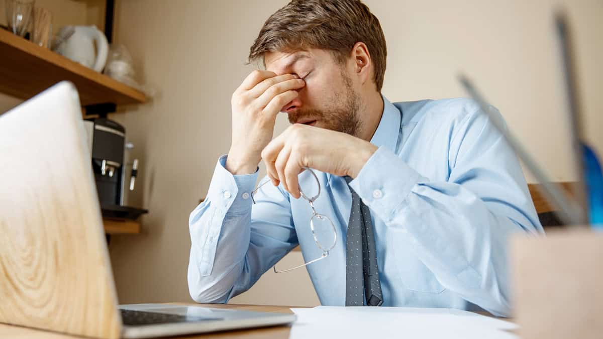 Man in office under stress