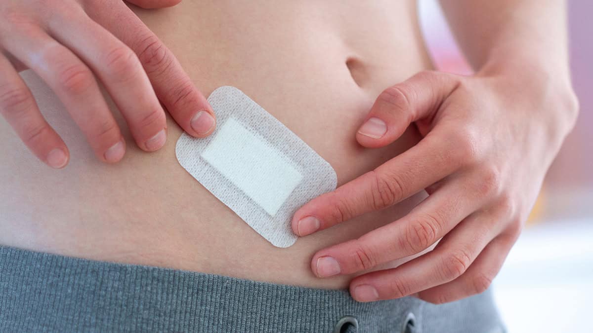 Person applying a patch