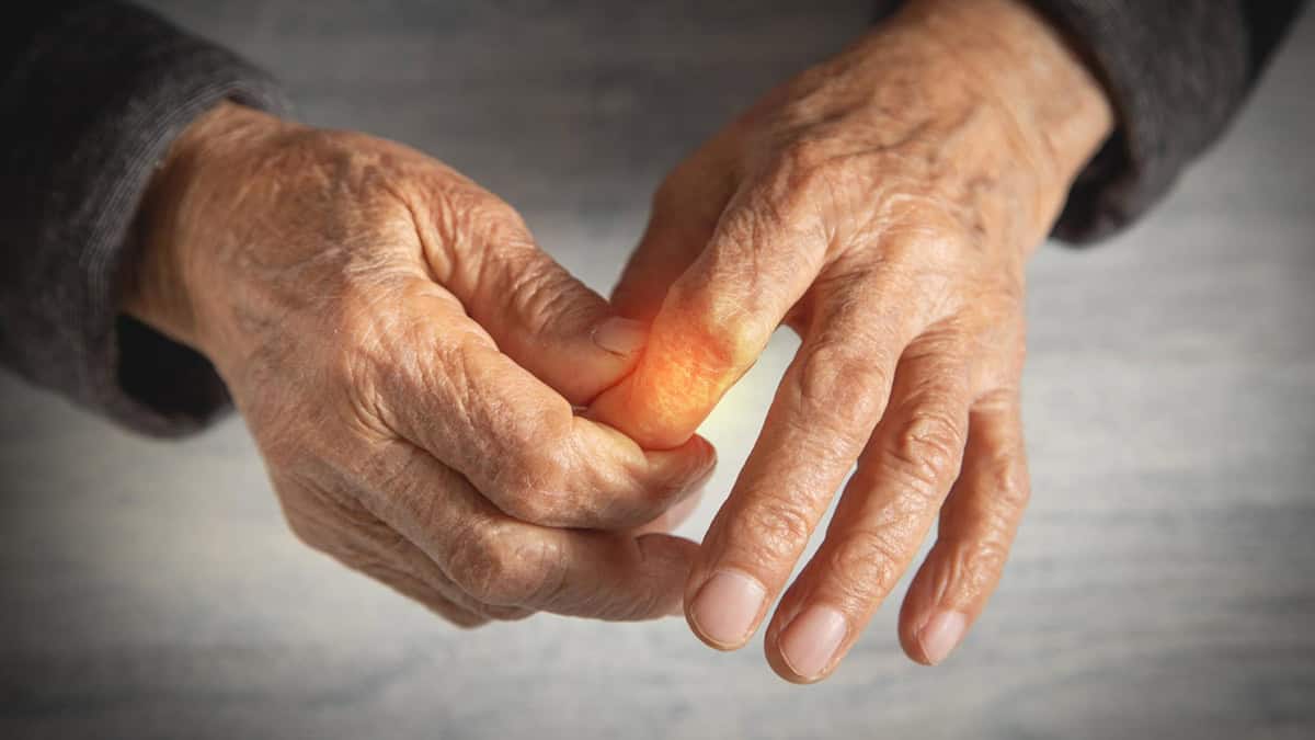 Elderly person having pain in his hand