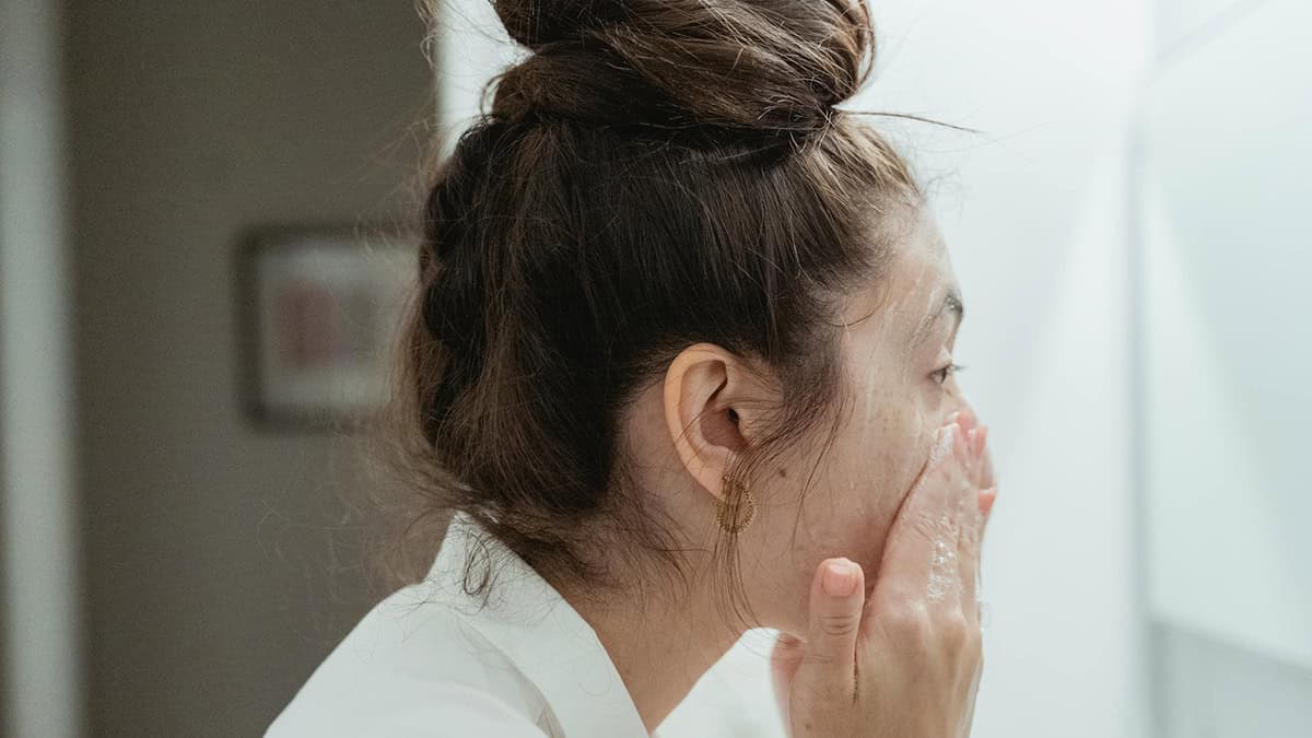 Women washing her face with soap