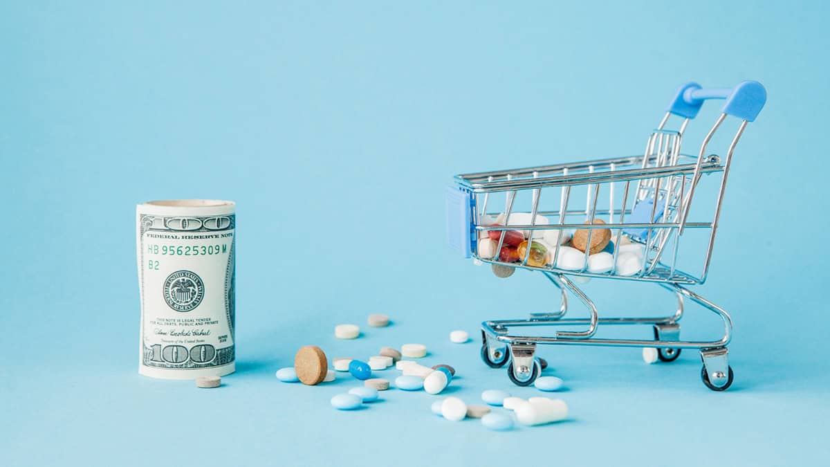 Money, shopping cart and medicine