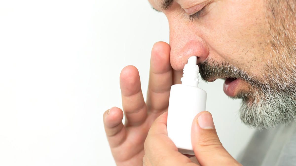 Person using a nasal spray