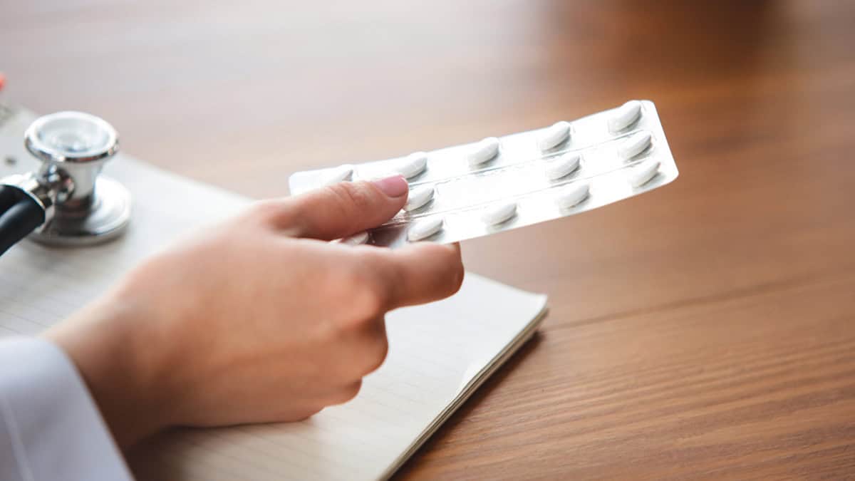 Doctor holding tablets