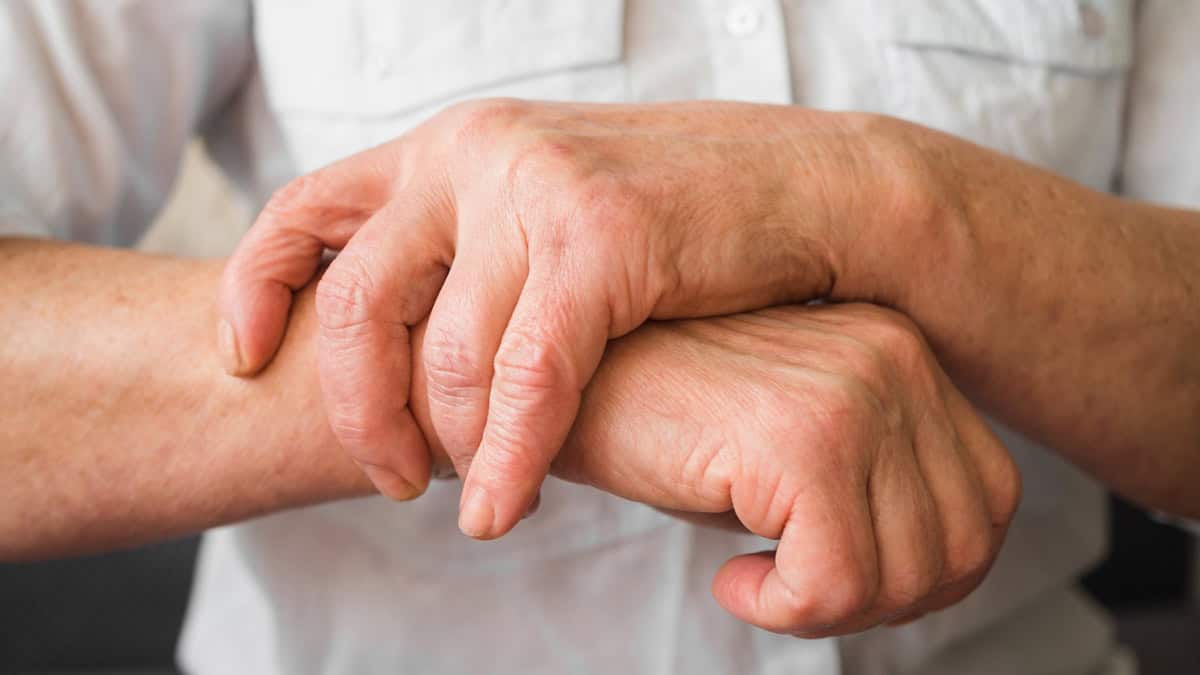 Person holding his wrist