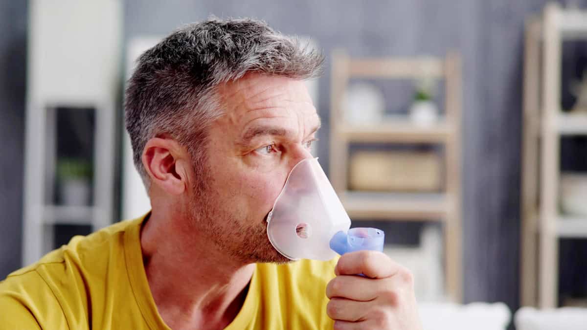 Person using an inhaler