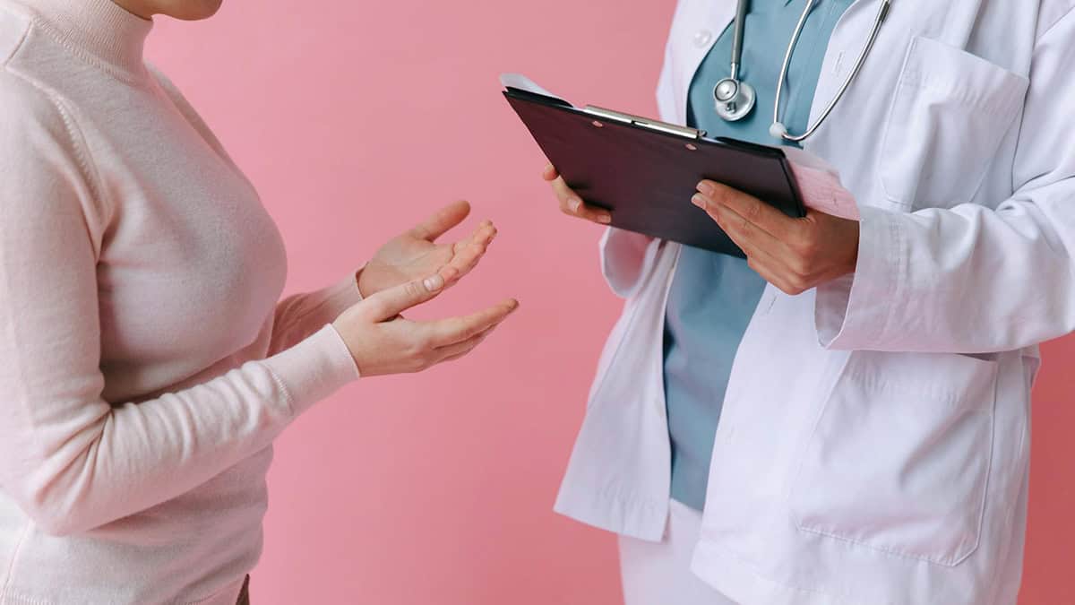 Women asking question to a health care provider